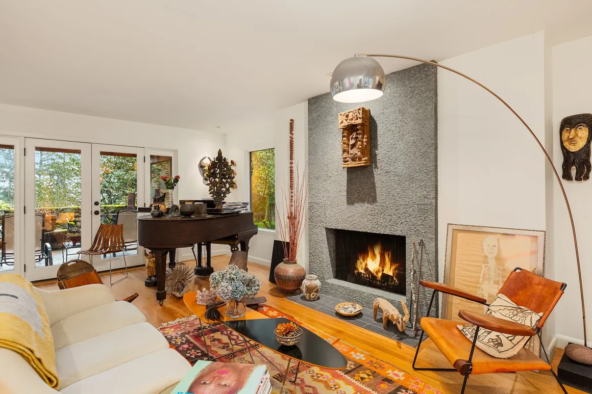 Living room with piano and fireplace