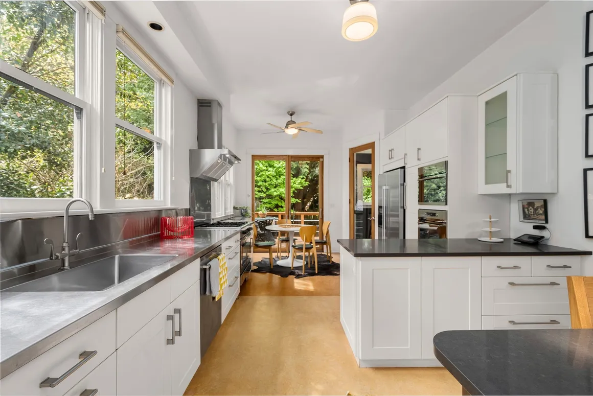 Bright white kitchen with cork floor