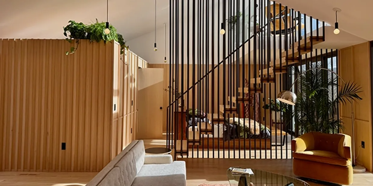Modern Portland interior with wood slats and atrium staircase